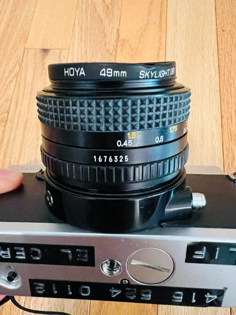 vintage Minolta XG-9 35mm SLR film camera equipped with a 50mm prime lens